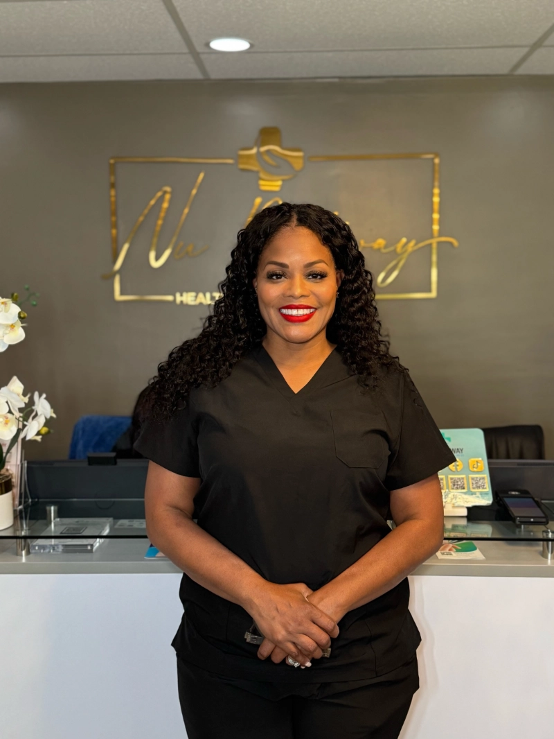 Lisa Nelson at the Nu Pathway front desk in Bowie